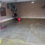 Team member prepping garage for epoxy resin before application to the floor.